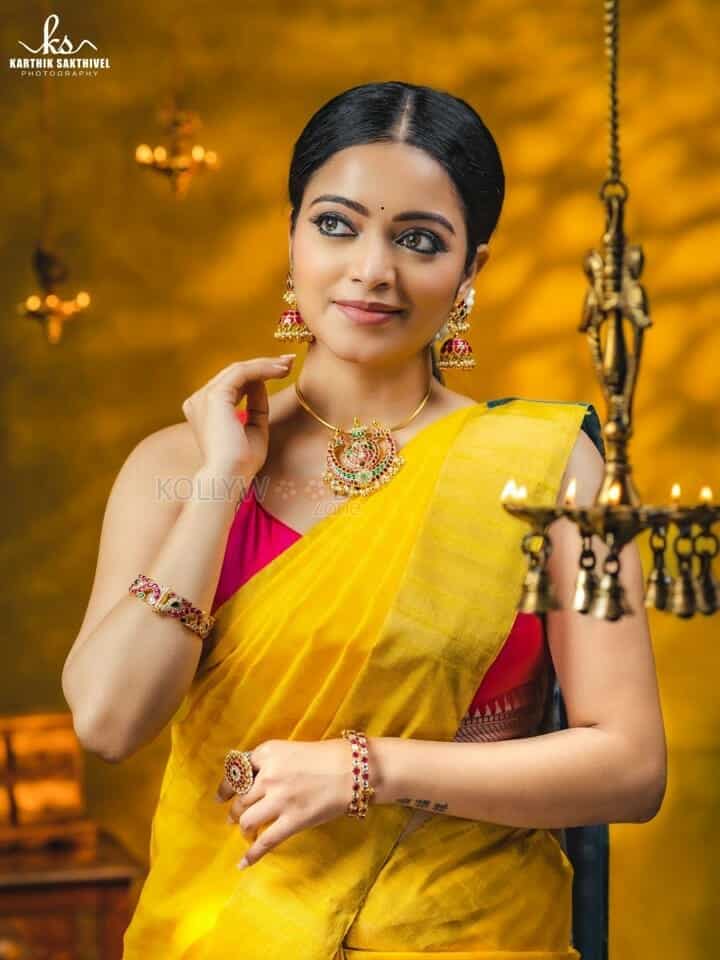 Actress Janani Iyer in a Traditional Yellow Saree Photoshoot Pictures 02