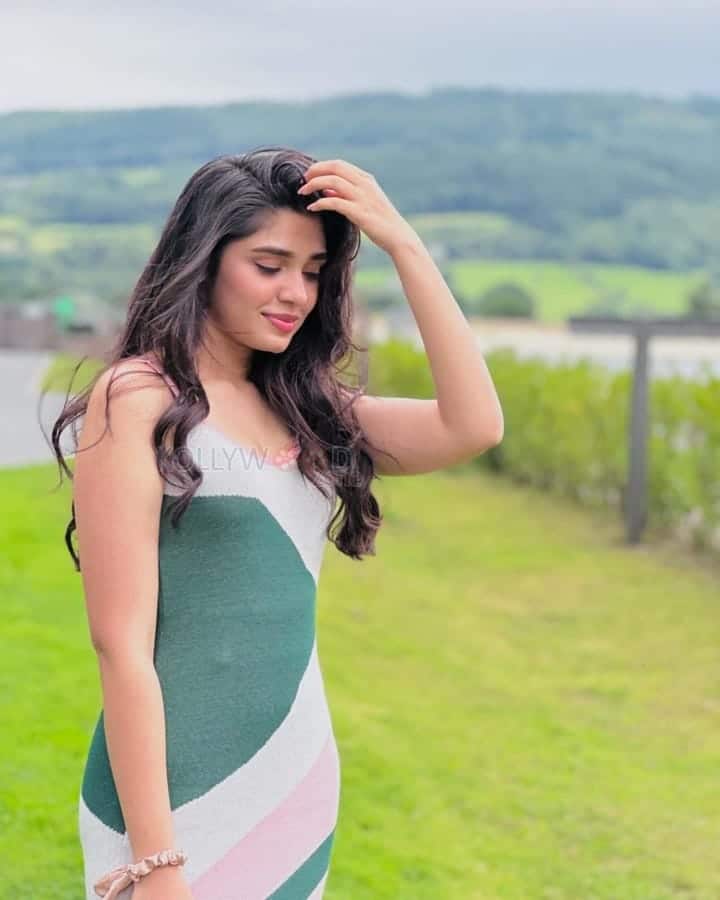 Beautiful Krithi Shetty in a Contrasting Knit Slit Cami Dress Photos 01