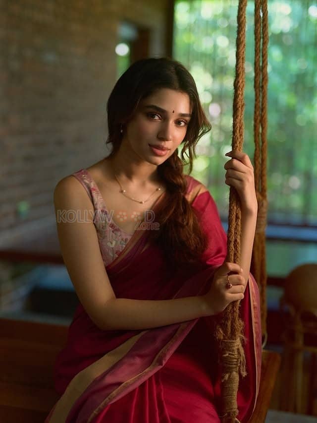 Beautiful Telugu Actress Krithi Shetty in a Maroon Red Silk Saree with a Cream Sleeveless Blouse Pictures 04