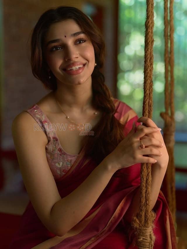 Beautiful Telugu Actress Krithi Shetty in a Maroon Red Silk Saree with a Cream Sleeveless Blouse Pictures 06