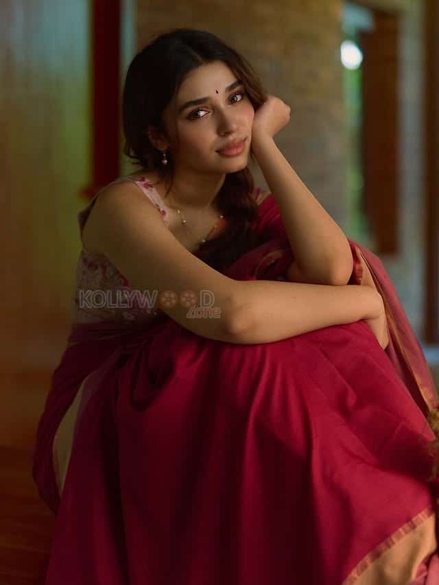 Beautiful Telugu Actress Krithi Shetty in a Maroon Red Silk Saree with a Cream Sleeveless Blouse Pictures 07