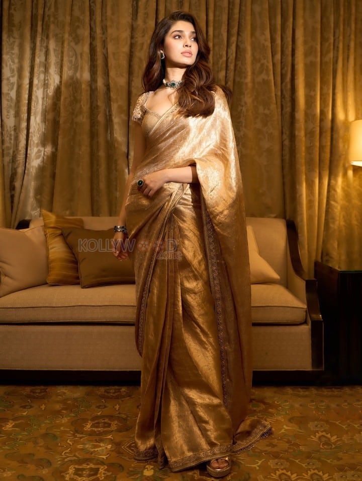 Mesmerizing Krithi Shetty in a Golden Saree with a Designer Saree Photos 08