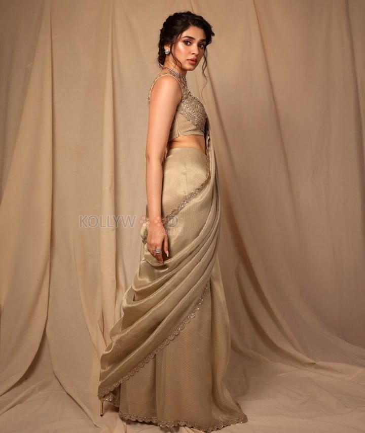 Stunning Krithi Shetty in a Golden Saree and Sleeveless Blouse Photos 03
