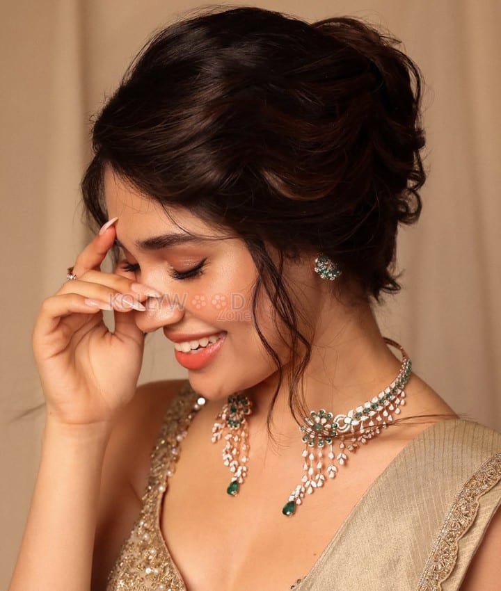 Stunning Krithi Shetty in a Golden Saree and Sleeveless Blouse Photos 07