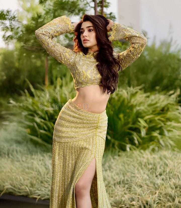 Stylish Krithi Shetty in a Shimmering Lime Green Co Ord Set with a Thigh Slit Skirt and High Neck Long Sleeve Top Photos 01