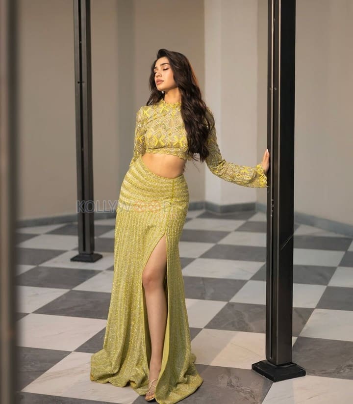 Stylish Krithi Shetty in a Shimmering Lime Green Co Ord Set with a Thigh Slit Skirt and High Neck Long Sleeve Top Photos 03