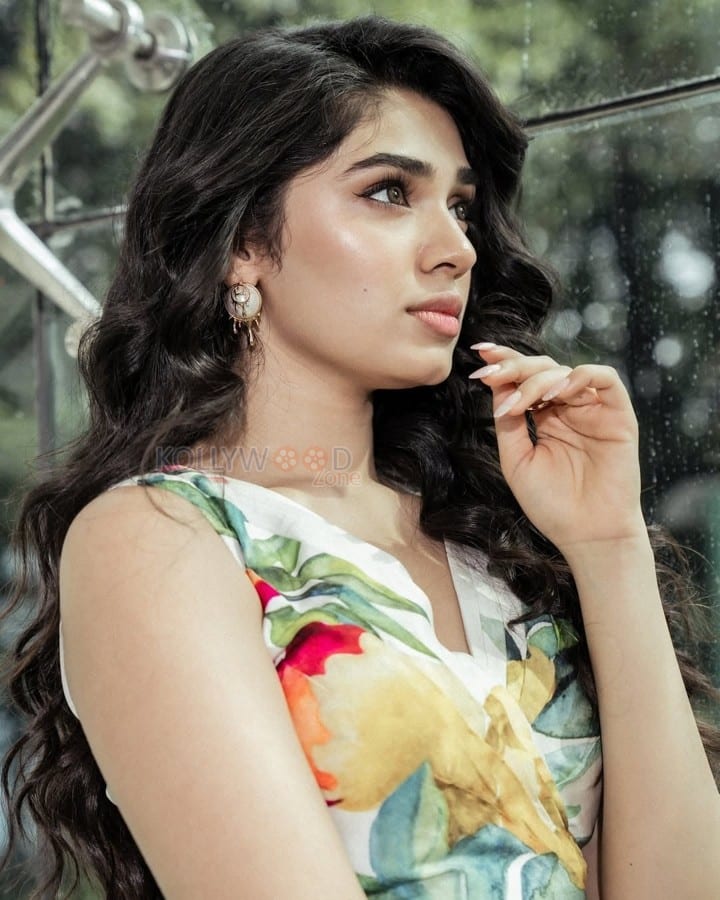 Stylish Telugu Beauty Krithi Shetty in a Multicolor Floral Cut Out Jumpsuit Photos 01