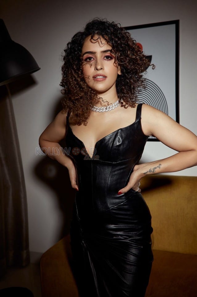 Actress Sanya Malhotra in a Black Leather Dress Photoshoot Pictures 01