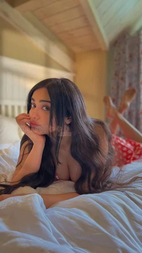 Seductive Adah Sharma on the Bed and Showing Cleavage Photos 02