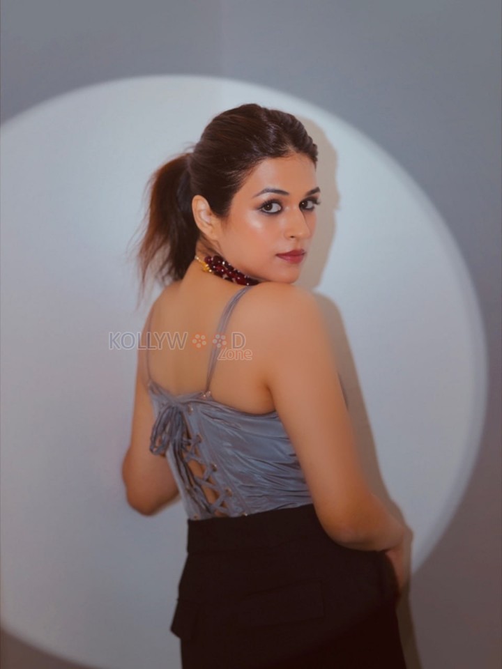 Stylish Shraddha Das in a Beige Sleeveless Corset Top with Black Pant Pictures 03