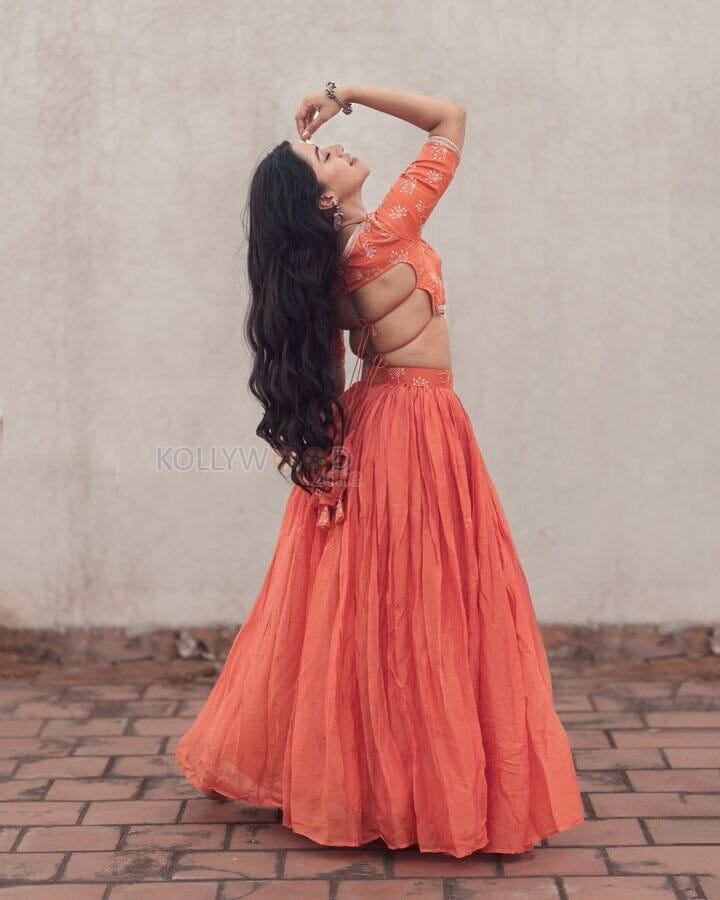 Sexy Mirnalini Ravi in a Orange Lehenga Photos 01