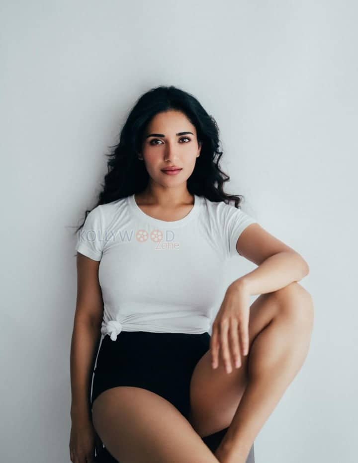 Charming Beauty Ruhani Sharma in a White Knotted T Shirt with a High Waisted Black Mini Shorts Photos 02