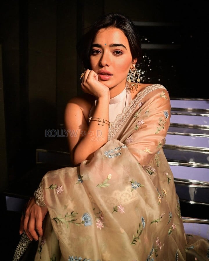 Charming and Elegant Ketika Sharma in a Cream Saree with a Halter Neck Semi Backless Blouse Photos 02