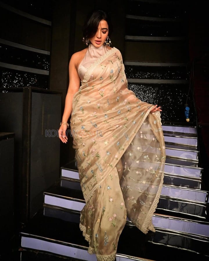 Charming and Elegant Ketika Sharma in a Cream Saree with a Halter Neck Semi Backless Blouse Photos 04