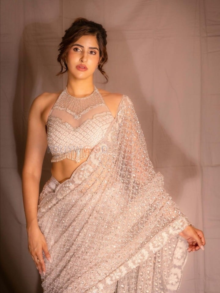 Dazzling Sakshi Malik in a White Embellished Saree with a Halter Neck Blouse Photos 01
