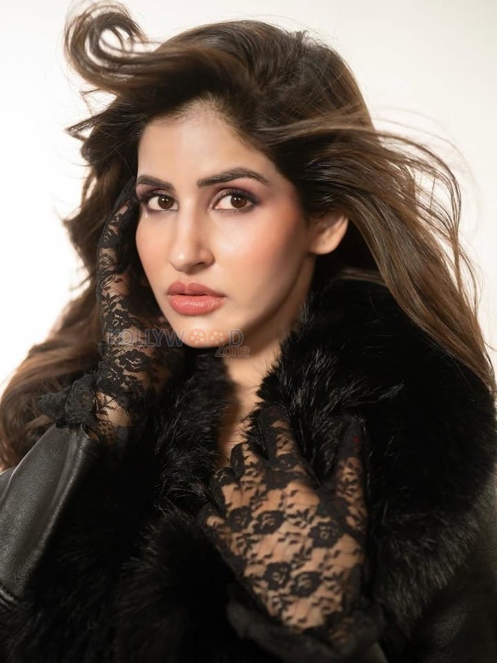 Glam Babe Sakshi Malik in a Black Leather Coat Mini Dress and Knee High Boots Photos 07