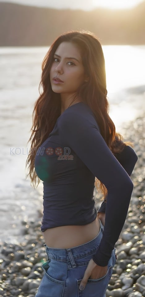 Sexy Sonam Bajwa in a Long Sleeve Crop Top and Denim Pant at the Beach Photos 01