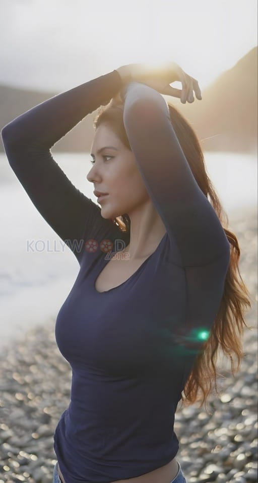 Sexy Sonam Bajwa in a Long Sleeve Crop Top and Denim Pant at the Beach Photos 05