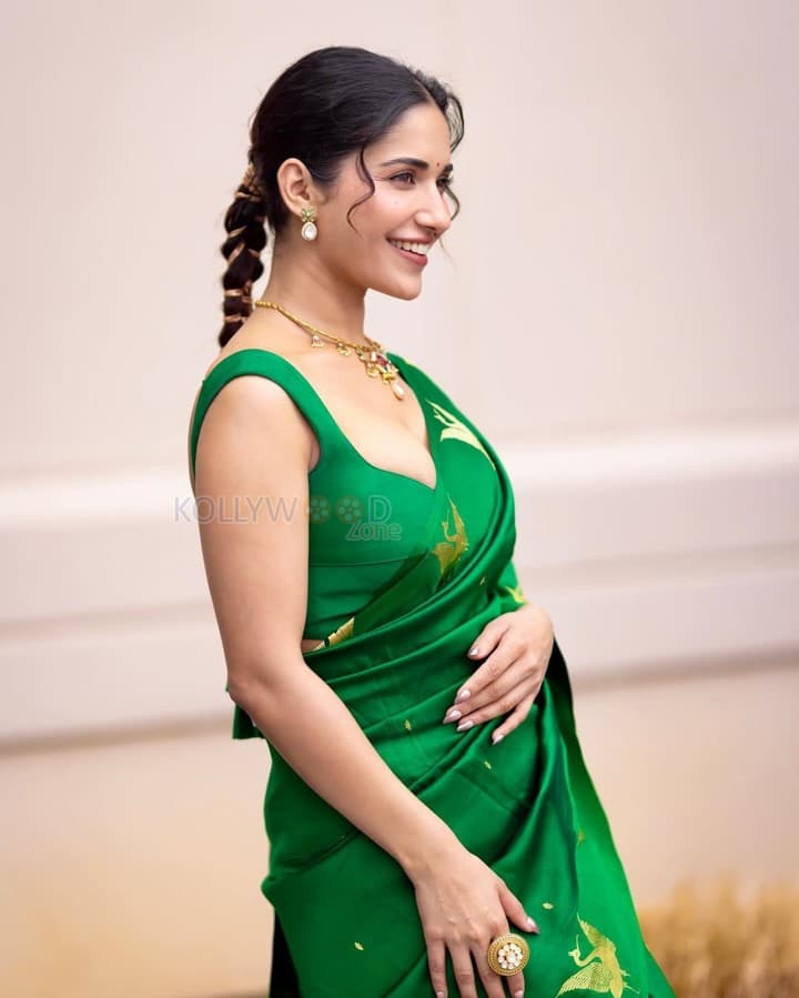 Stunning Ruhani Sharma in an Emerald Green Saree with Golden Peacock Design Photos 03