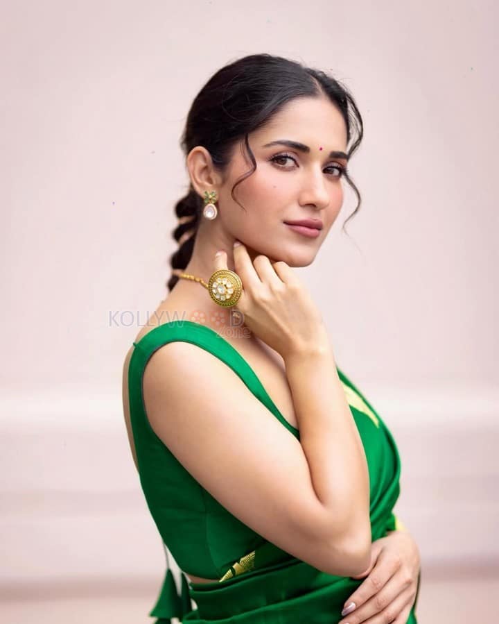 Stunning Ruhani Sharma in an Emerald Green Saree with Golden Peacock Design Photos 05