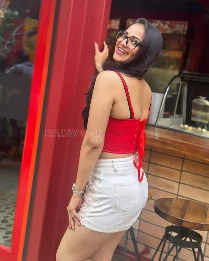 Actress Ashwini Sri in a Mini Red Top and White Shorts Photos 02