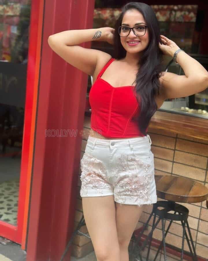 Actress Ashwini Sri in a Mini Red Top and White Shorts Photos 07