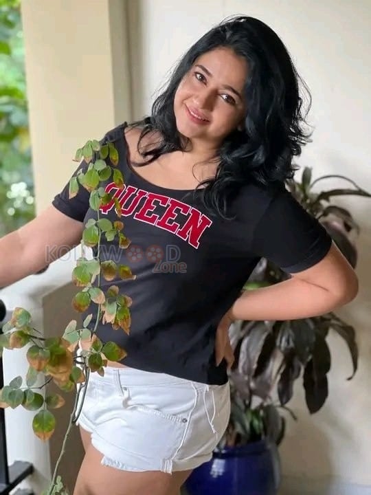 Actress Poonam Bajwa in Black T Shirt and White Mini Shorts Photos 01