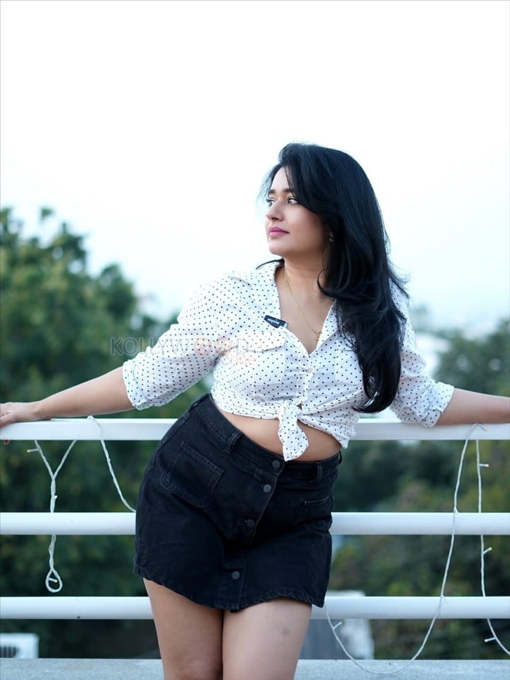 Beautiful Busty Poonam Bajwa in a White Polka Dot Printed Front Knotted Shirt with a High Waisted Denim Mini Skirt Photos 02