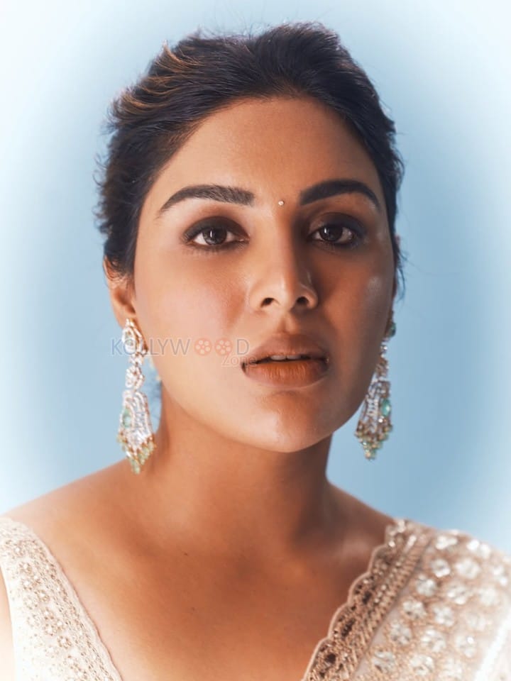 Beautiful Samyuktha Menon in an Ivory Embroidered Saree with Sleeveless Blouse Photos 01