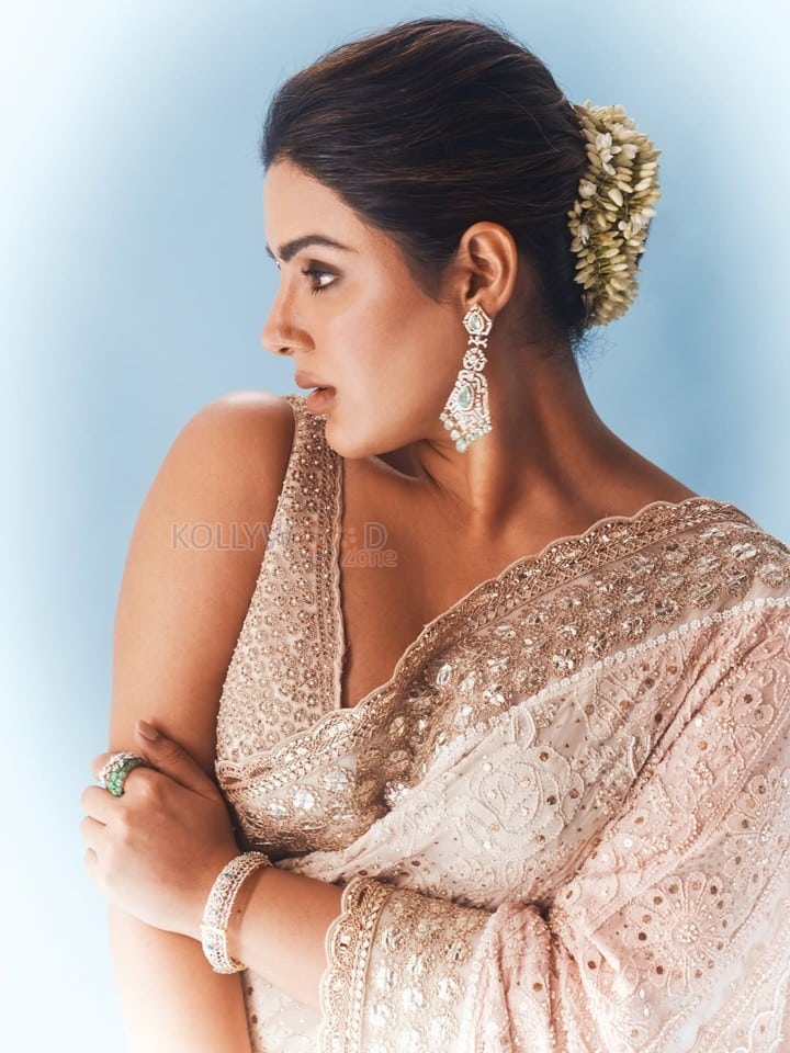 Beautiful Samyuktha Menon in an Ivory Embroidered Saree with Sleeveless Blouse Photos 04