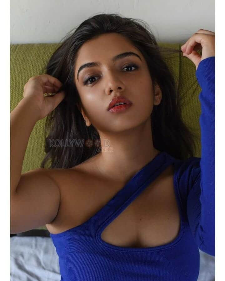 Sizzling Ahsaas Channa in a Blue One Piece On the Bed Photoshoot Pictures 03