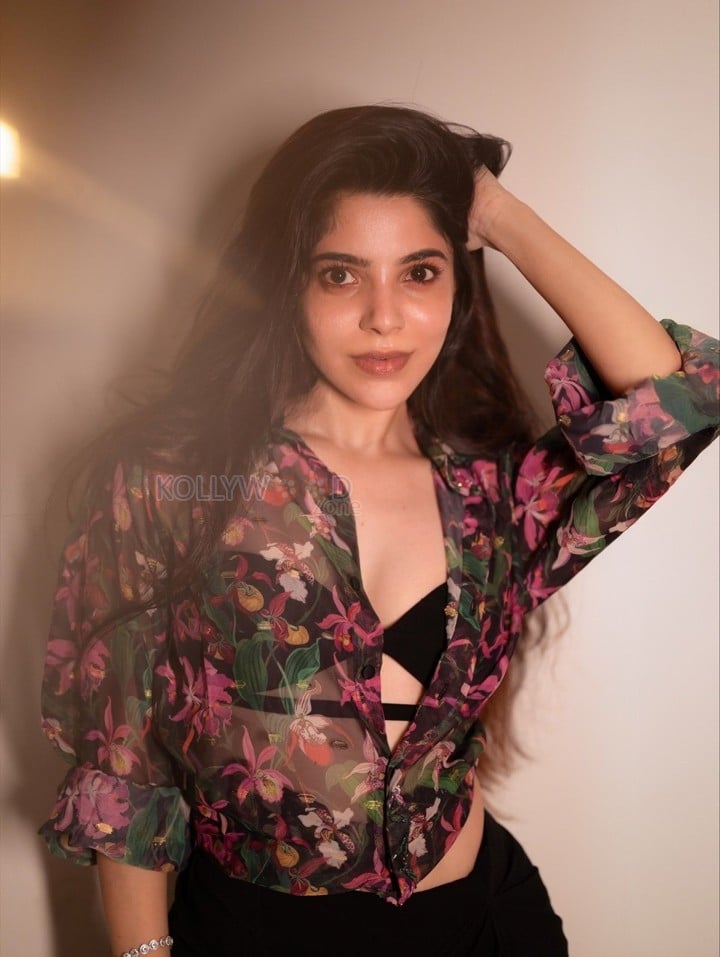 Charming Divya Bharathi in a Floral Printed Sheer Top over a Black Bralette and a Black Skirt Pictures 06