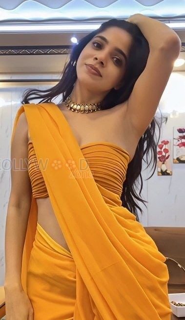 Glamorous Divya Bharathi in a Yellow Saree and Strapless Blouse Pictures 01