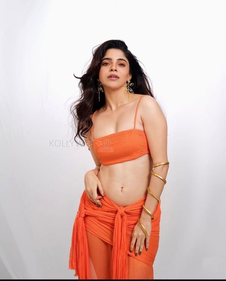 Sultry Hottie Divya Bharathi Navel in an Orange Dress Photos 01