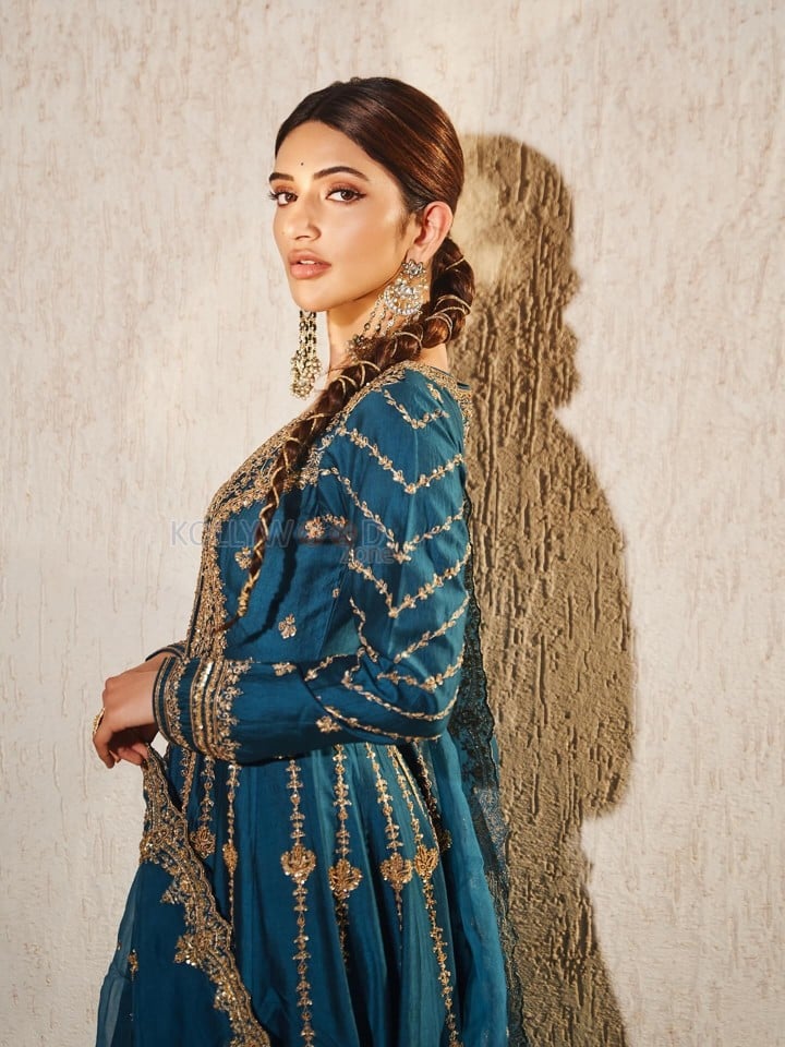 American Born Tollywood Actress Sreeleela in a Teal Blue Traditional Lehenga with Golden Embroidery Photos 01