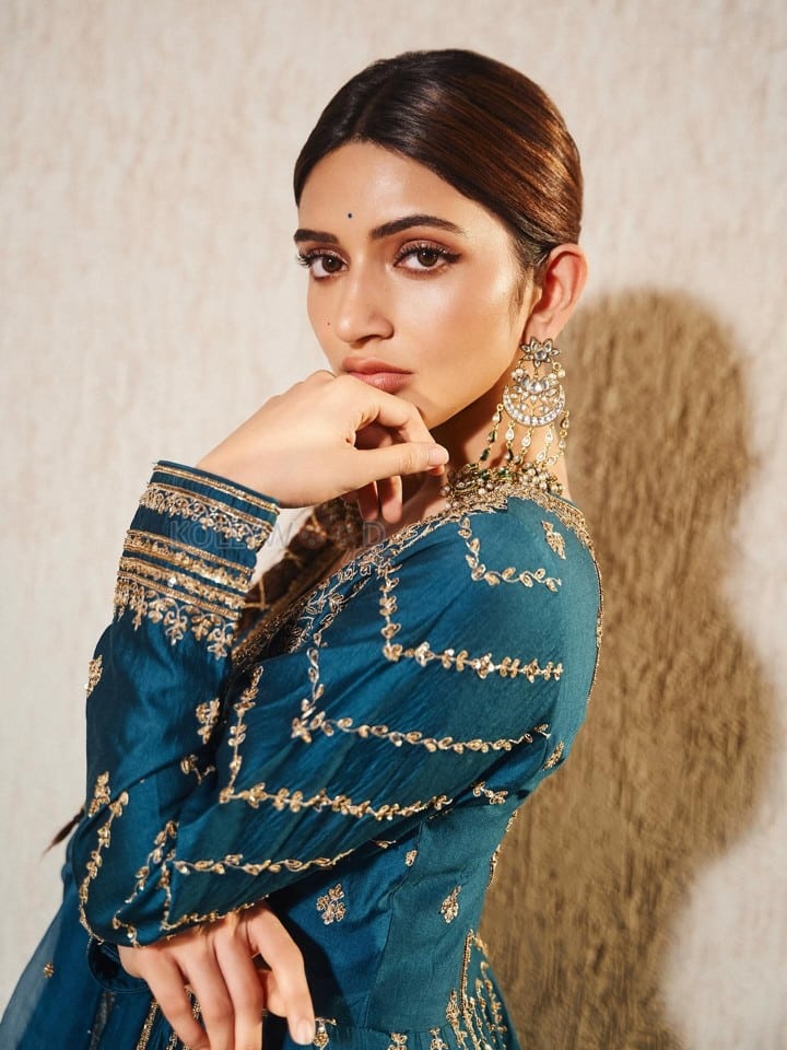 American Born Tollywood Actress Sreeleela in a Teal Blue Traditional Lehenga with Golden Embroidery Photos 02