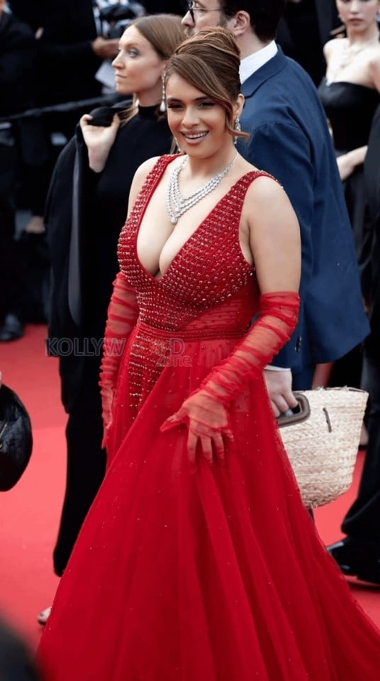 Bold and Busty Neha Malik in a Red Crystal Embellished Scarlet Gown with a Cleavage Revealing Neckline Photos 03