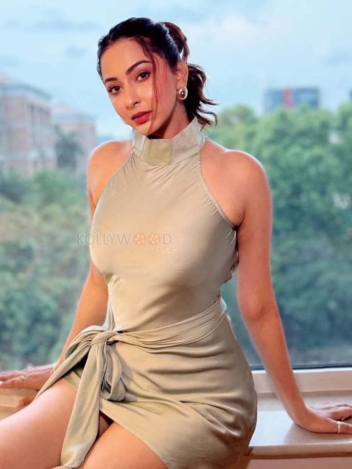 Glam Beauty Eshanya Maheshwari in a Tied Up Satin Halter Neck Short Dress Photos 01