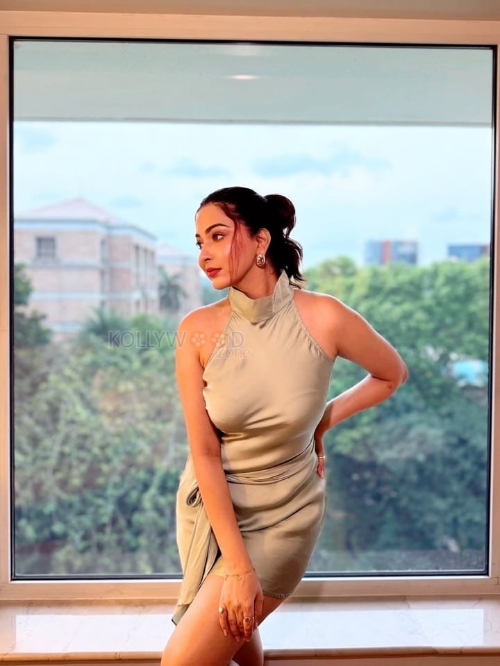 Glam Beauty Eshanya Maheshwari in a Tied Up Satin Halter Neck Short Dress Photos 02