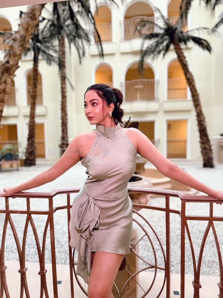 Glam Beauty Eshanya Maheshwari in a Tied Up Satin Halter Neck Short Dress Photos 04