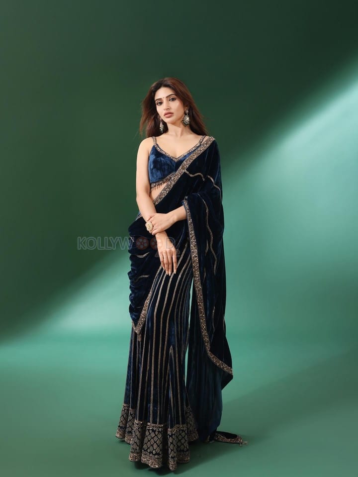 Gorgeous Telugu Actress Sreeleela in a Navy Blue Velvet Saree with Embroidered Sharara Pants Photos 03
