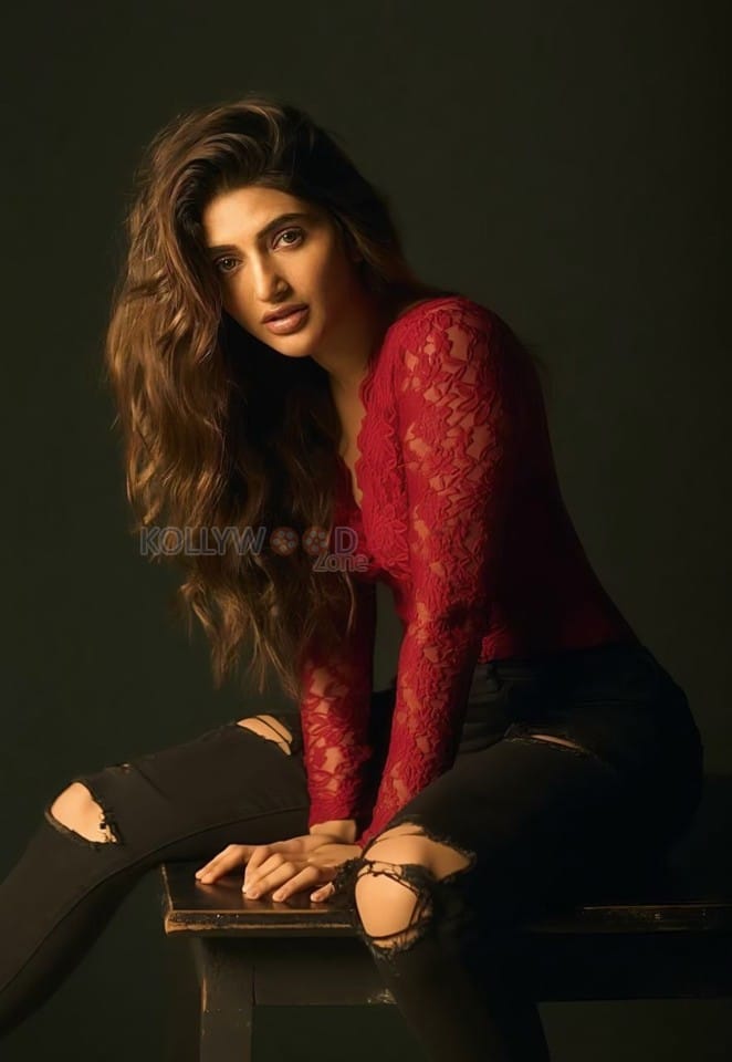 Kissik Girl Sreeleela in a Sleek Red Maroon Lace Full Sleeve Top and Ripped Black Jeans Photos 04