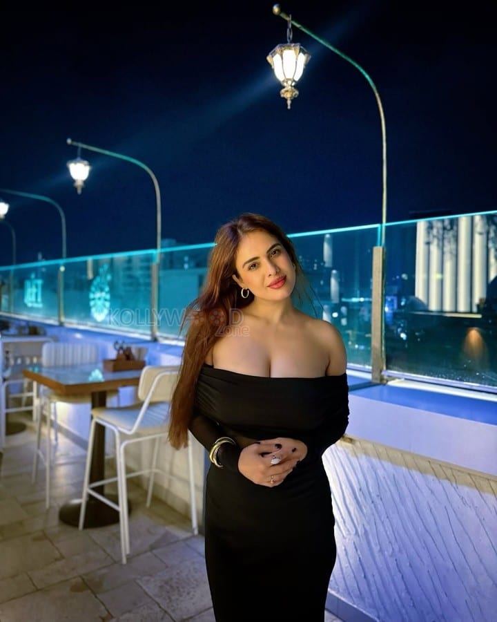Sexy Neha Malik in a Black Off Shoulder Bodycon Maxi Dress Photos 01