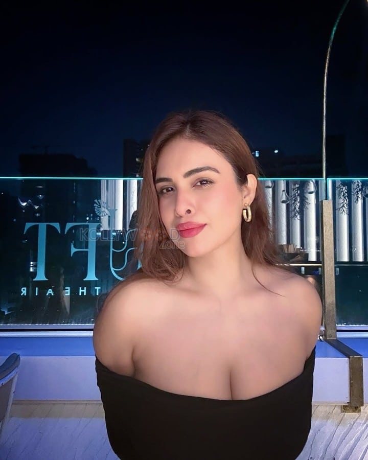 Sexy Neha Malik in a Black Off Shoulder Bodycon Maxi Dress Photos 02