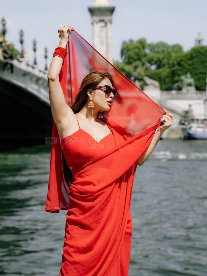Sexy Neha Malik in a Red Saree with Matching Spaghetti Strap Sleeveless Blouse Pictures 02