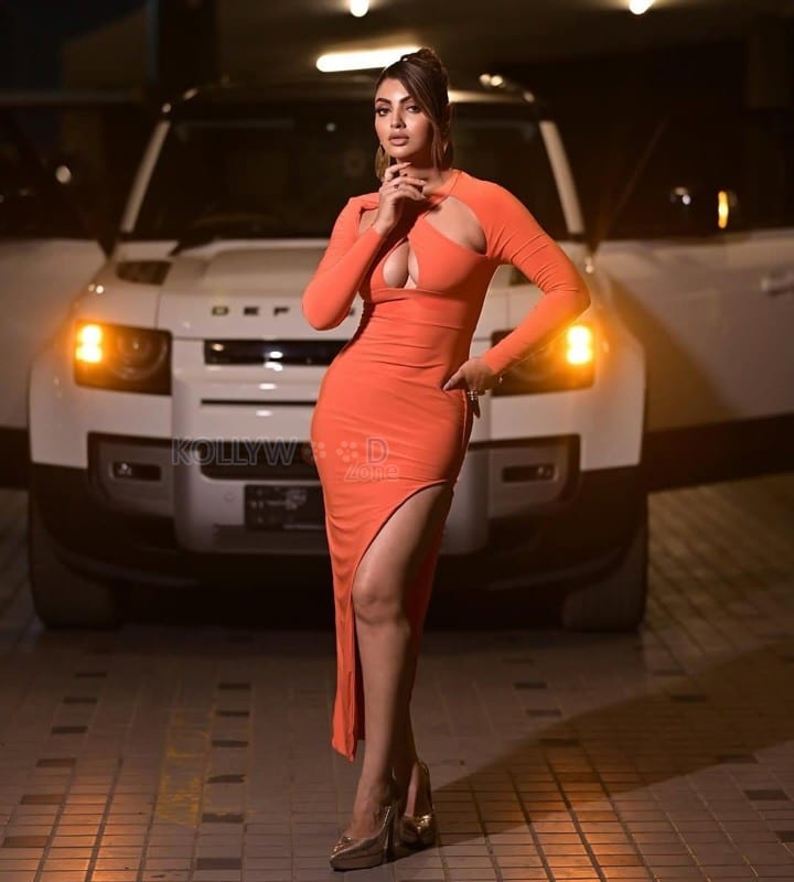 Amazing Aakansha Puri Boobs Cleavage in an Orange Bodycon Dress Pictures 04