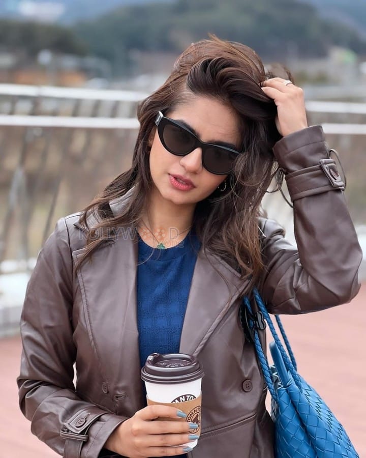 Beautiful Anushka Sen in a Blue Bodycon Dress with a Brown Leather Jacket Photos 01