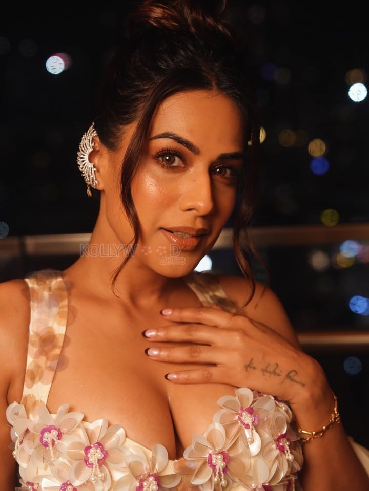 Captivating Nia Sharma in a Bustier Deep Neck Backless Bralette Top and Mermaid Skirt Photos 01