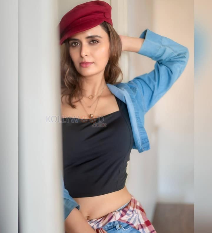 Local Train Actress Meenakshi Dixit in a Black Crop Top with a Matching Denim Mini Shorts and Jacket Photos 01
