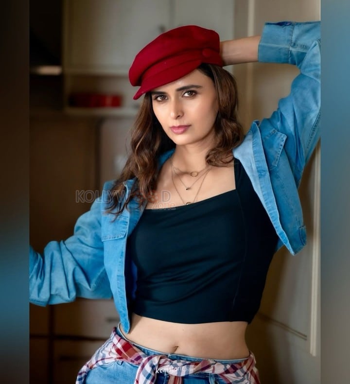Local Train Actress Meenakshi Dixit in a Black Crop Top with a Matching Denim Mini Shorts and Jacket Photos 02